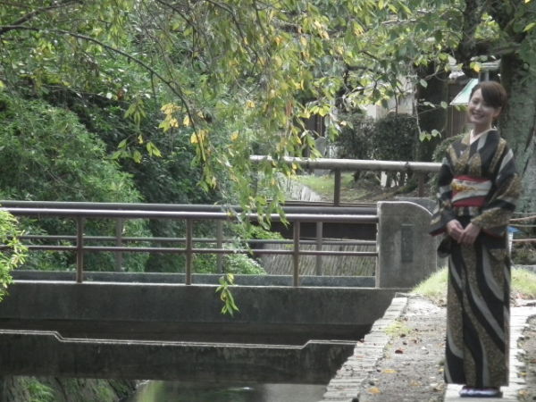 Japanese woman posing along the Philosopher's Path Philospher's Path, Kyoto
