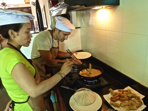 Stefan deep frying steam rolls in Hoi An