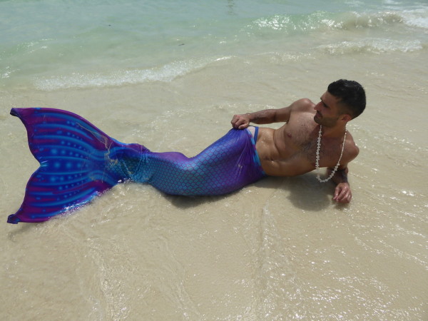 Stefan posing and swimming like a mermaid on Boracay's White Beach