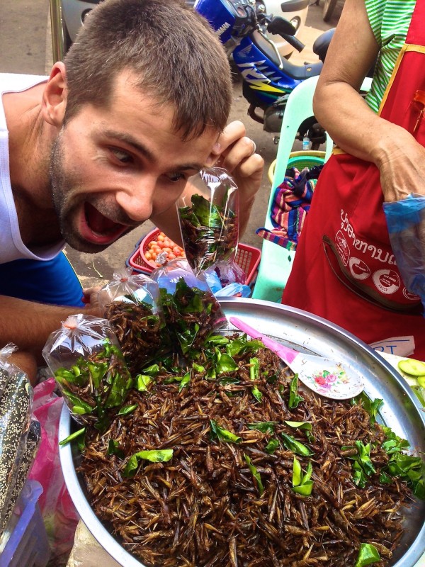 Sebastien with fried grasshoppers Sebastien with fried grasshoppers
