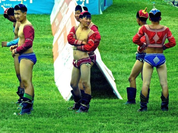 Wrestlers wear open sleeved tops