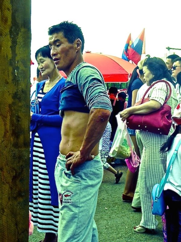 Man in Central Monglia with his top rolled up