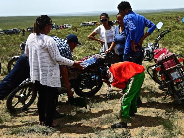 Naadam horse rider washing