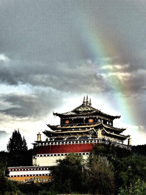 The Guishan Temple with rainbow - like a beacon of hope for Shangri-La The Guishan Temple with rainbow - like a beacon of hope for Shangri-La