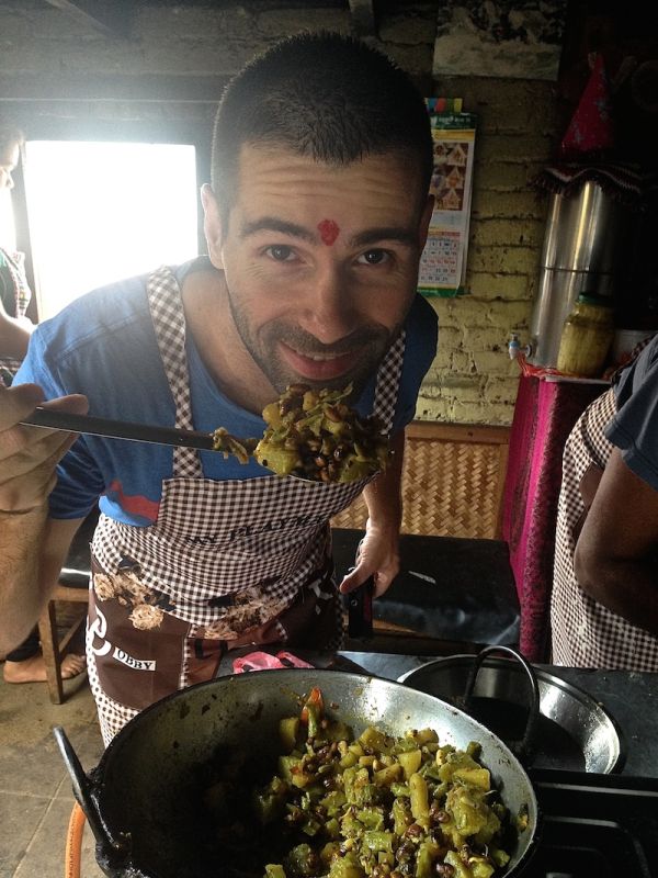 Sebastien showing off the completed vegetable curry Sebastien showing off the completed vegetable curry