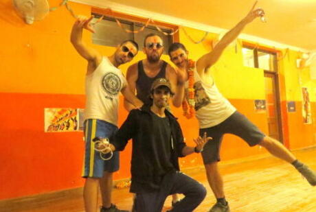 Gay guys learning to dance bhangra in Delhi
