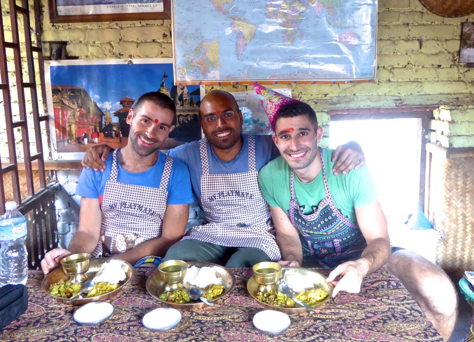 Stefan Seby eating traditional Nepalese dal bhat with their friend Talib in Kathmandu.