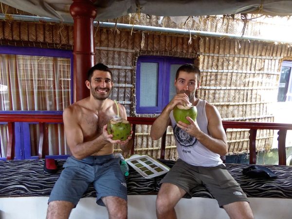 A refreshing welcome on boat with a tasty coconut drink A refreshing welcome on boat with a tasty coconut drink