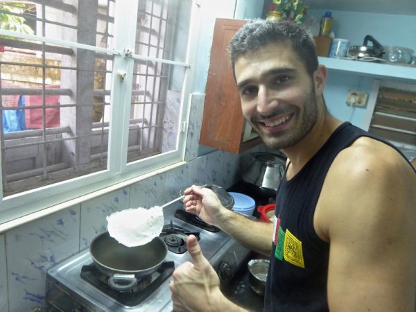 Stefan with freshly made palappam Stefan with freshly made palappam