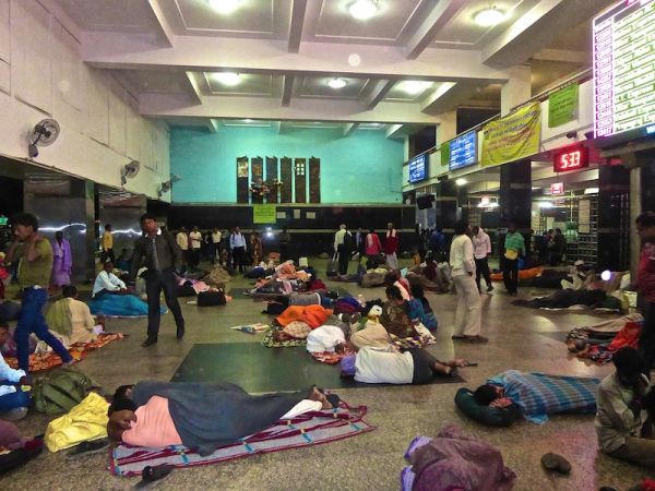 People sleeping rough inside Delhi's train station Love hate India intense poverty Delhi main train station