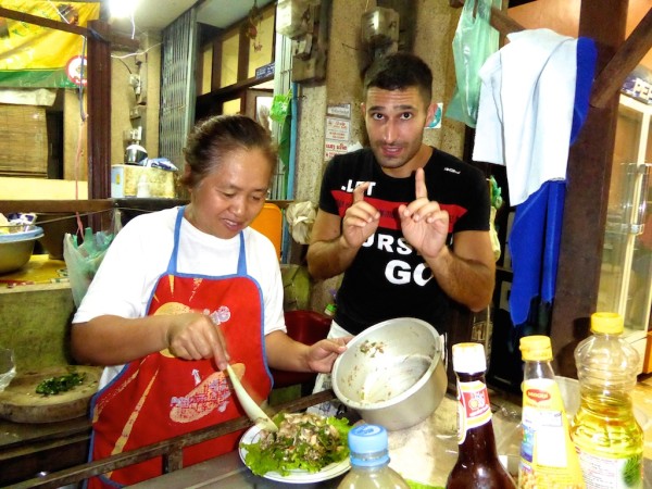 Stefan learning how to make Laotian buffalo laap