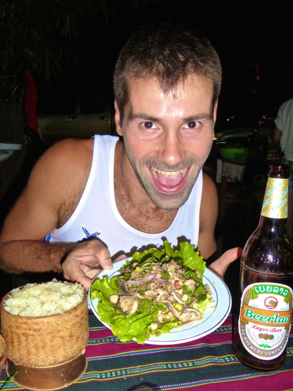 Seb enjoying buffalo laap with sticky rice and a Beerlao Seb enjoying buffalo laap with sticky rice and a Beerlao