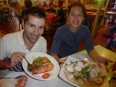 Sebastien and Jason enjoying seafood in Sandakan