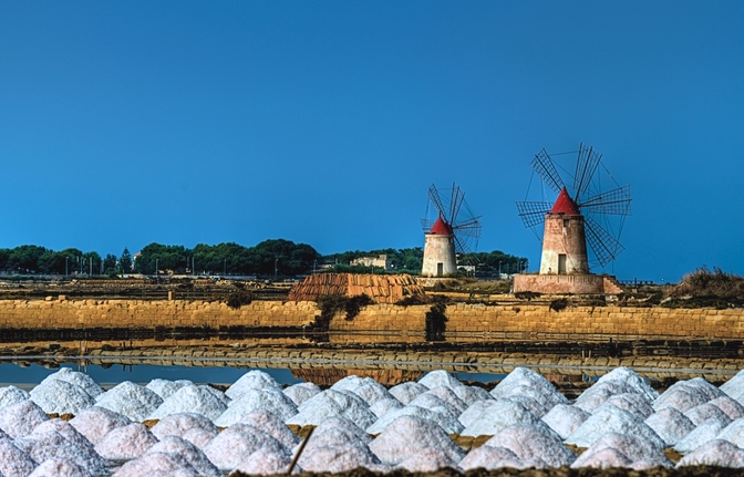 Salt pans at sunset one of romantic things to do in sicily