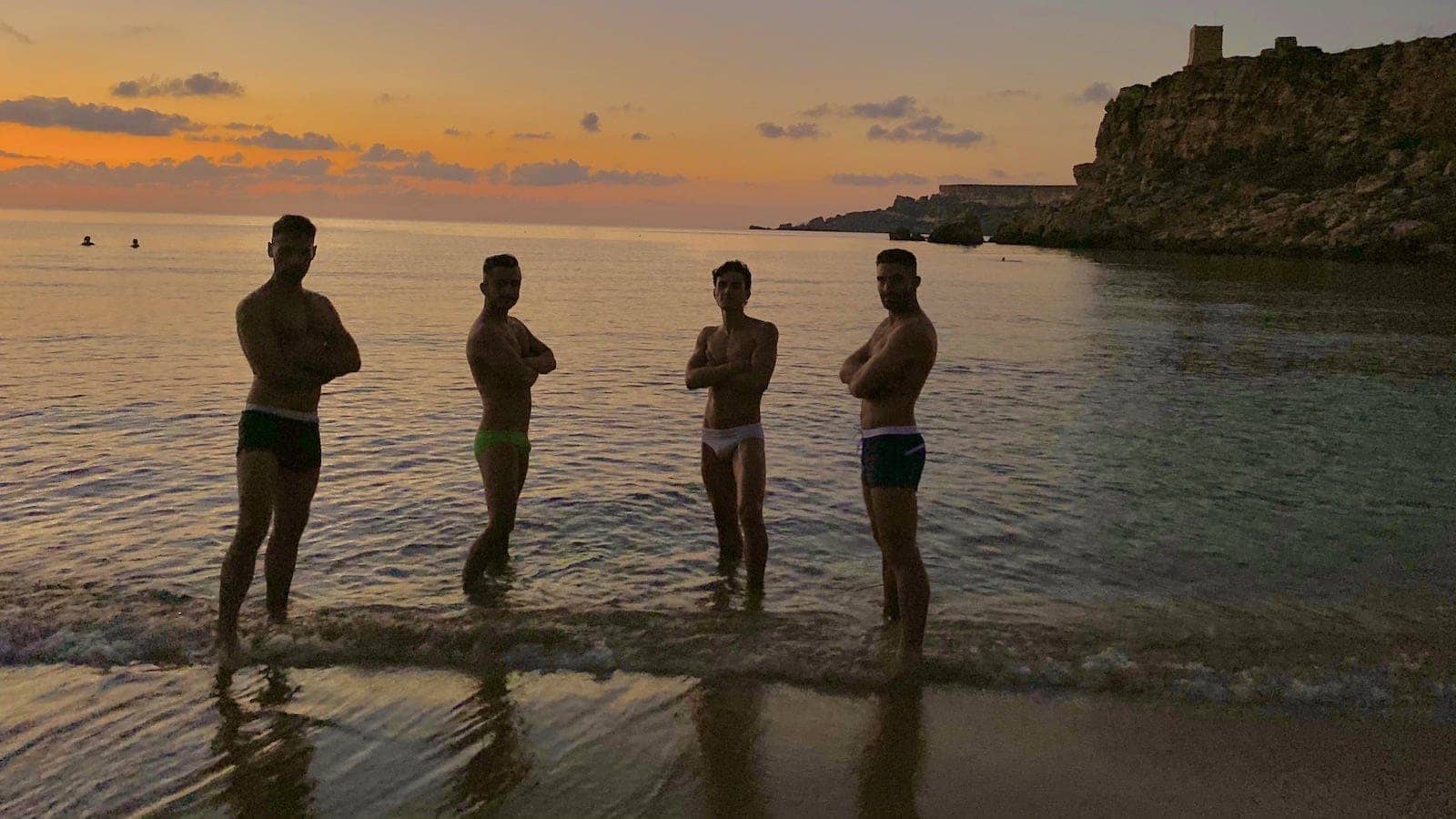 Gay guys posting at Il Buco one of the best gay beaches in Europe