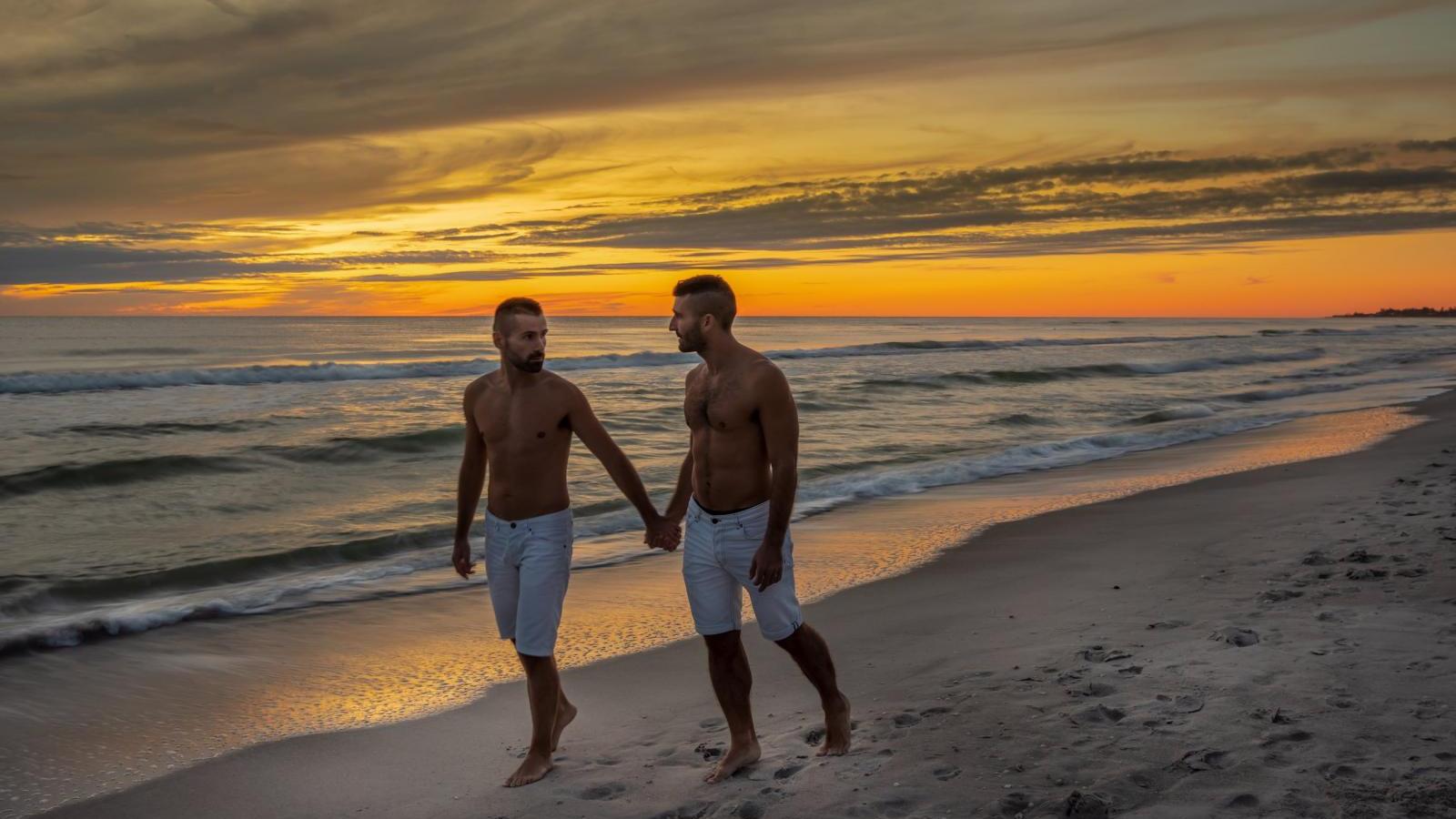 Romantic walk on Siesta Key beach at sunset