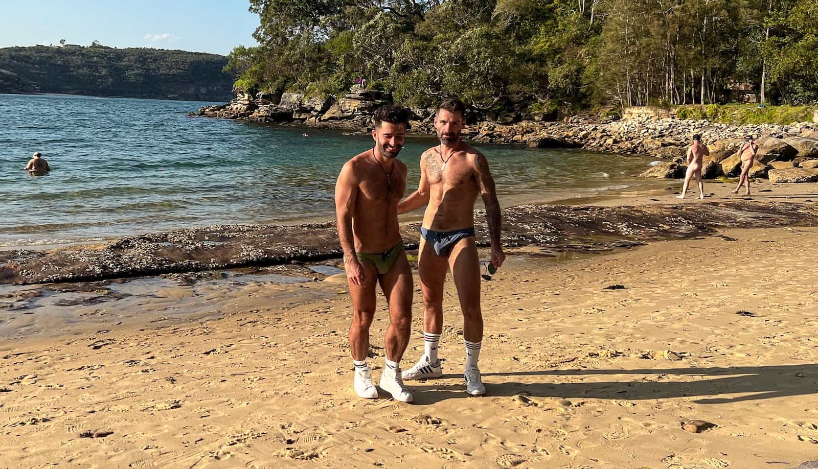 Gay couple at Cobblers gay beach in Sydey.