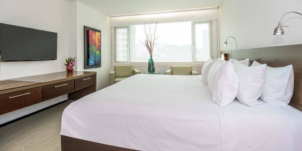 For sleek minimalism and luxury, stay at the gay friendly 5 star NH Collection Royal Medellin Hotel
