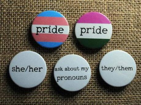 A cute badge telling people your pronouns is a must have accessory for pride