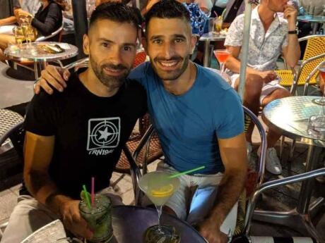 Stefan and Sebastien having cocktails at Parrots gay cafe in Sitges