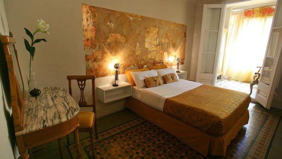 For a budget stay that still feels opulent, you'll love the gold decor at the Vrabac Guesthouse in Barcelona