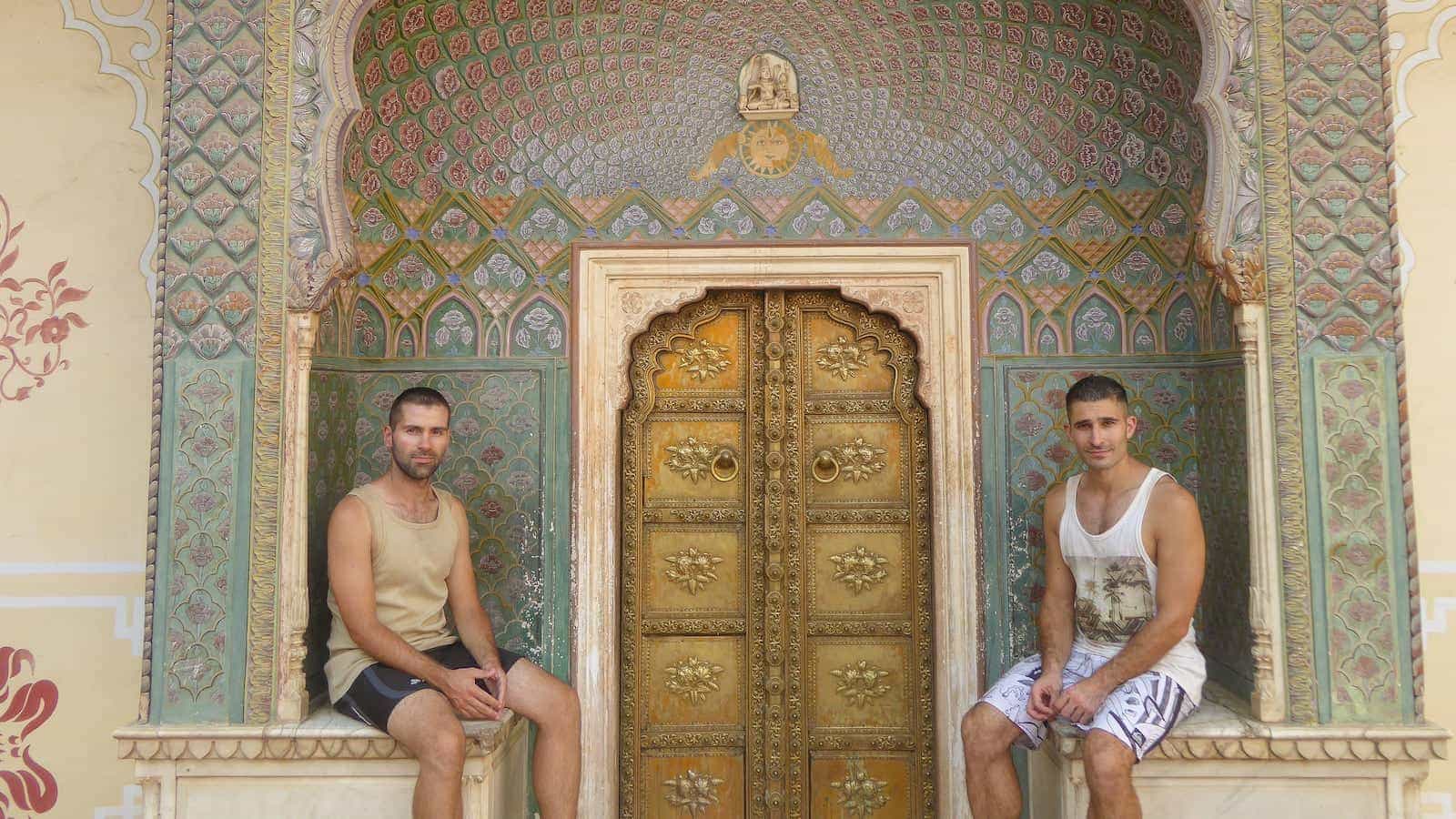 Gay couple exploring the City Palace of Jaipur.