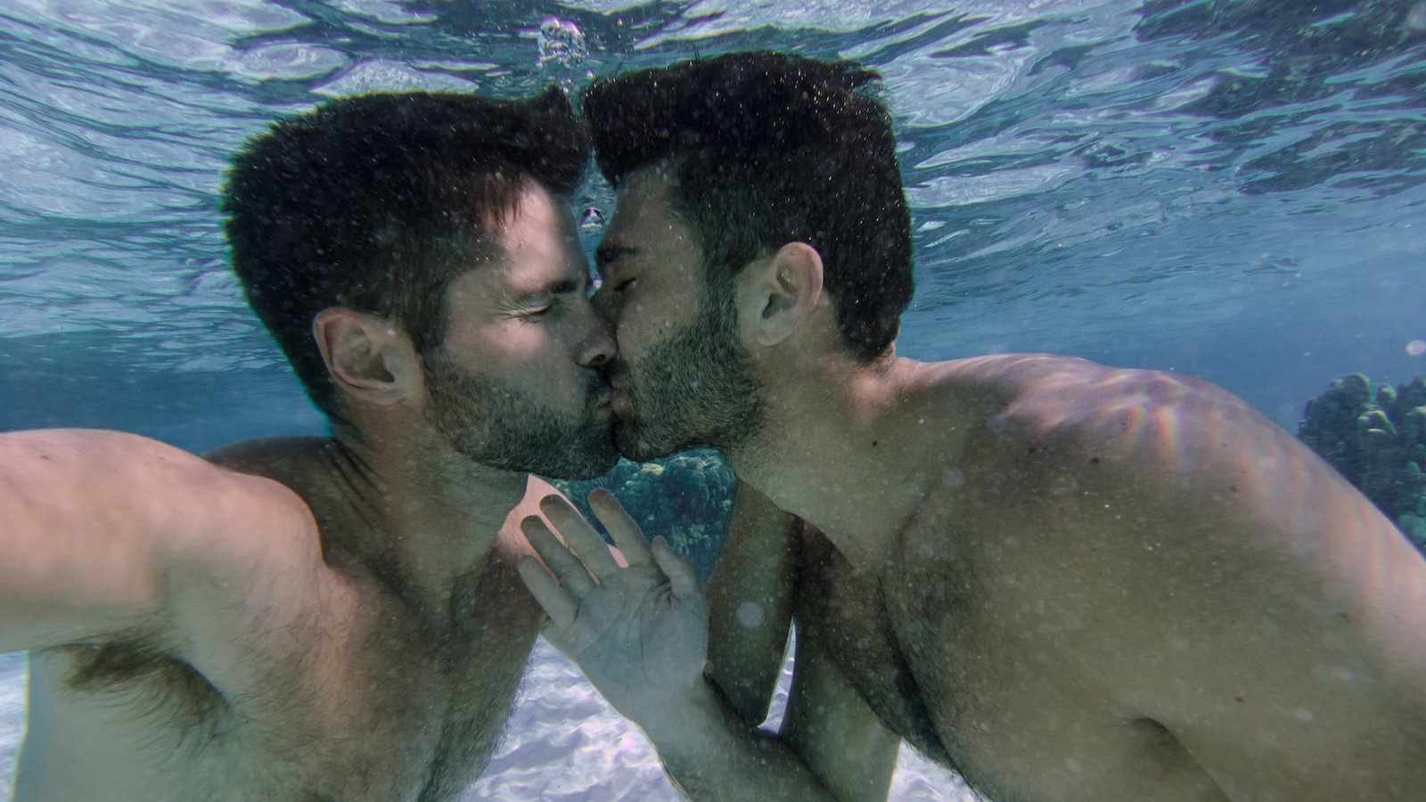 gay men kissing in pool