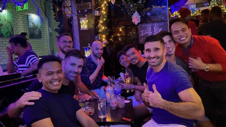 Group of gay guys at gay Stranger Bar in Bangkok.