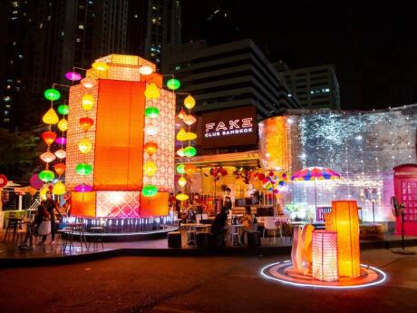 The cool and colorful exterior of Fake Club in Bangkok lit up at night.