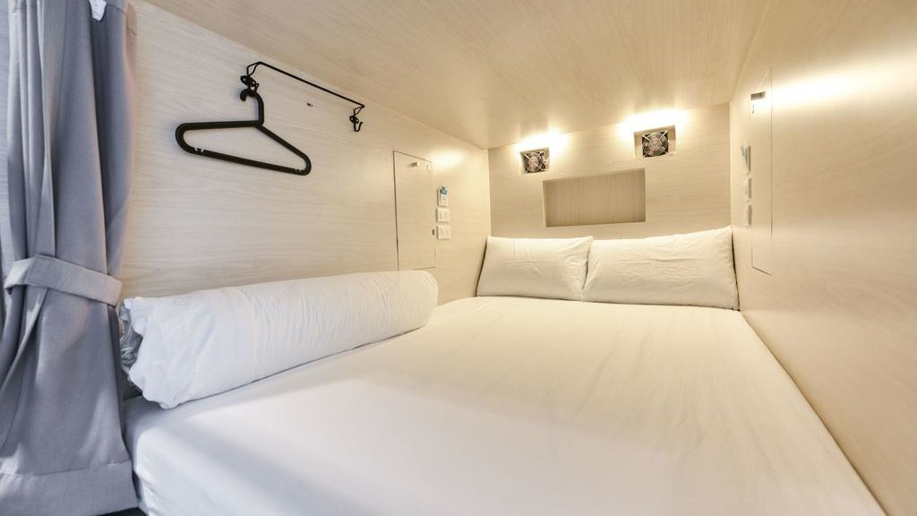You can experience a pod hostel at Bangkok's gay friendly The Cube Hostel