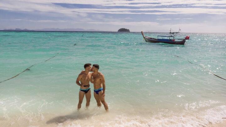 Gay couple kissing in Koh Lipe island in Thailand