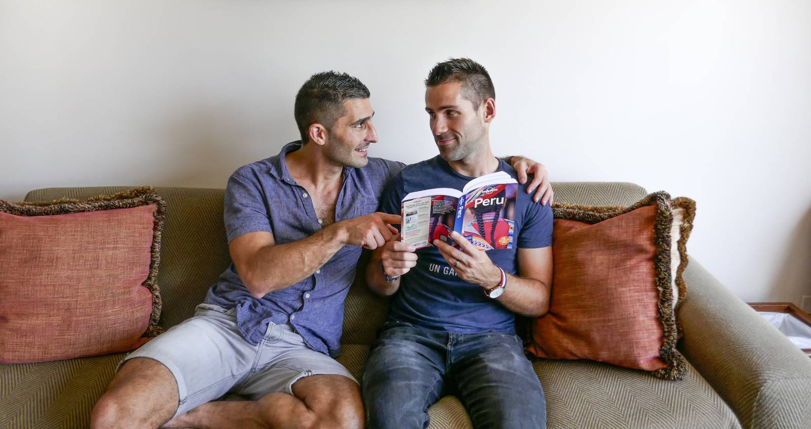 Nomadic Boys in Peru reading The lonely planet to find out if it is safe