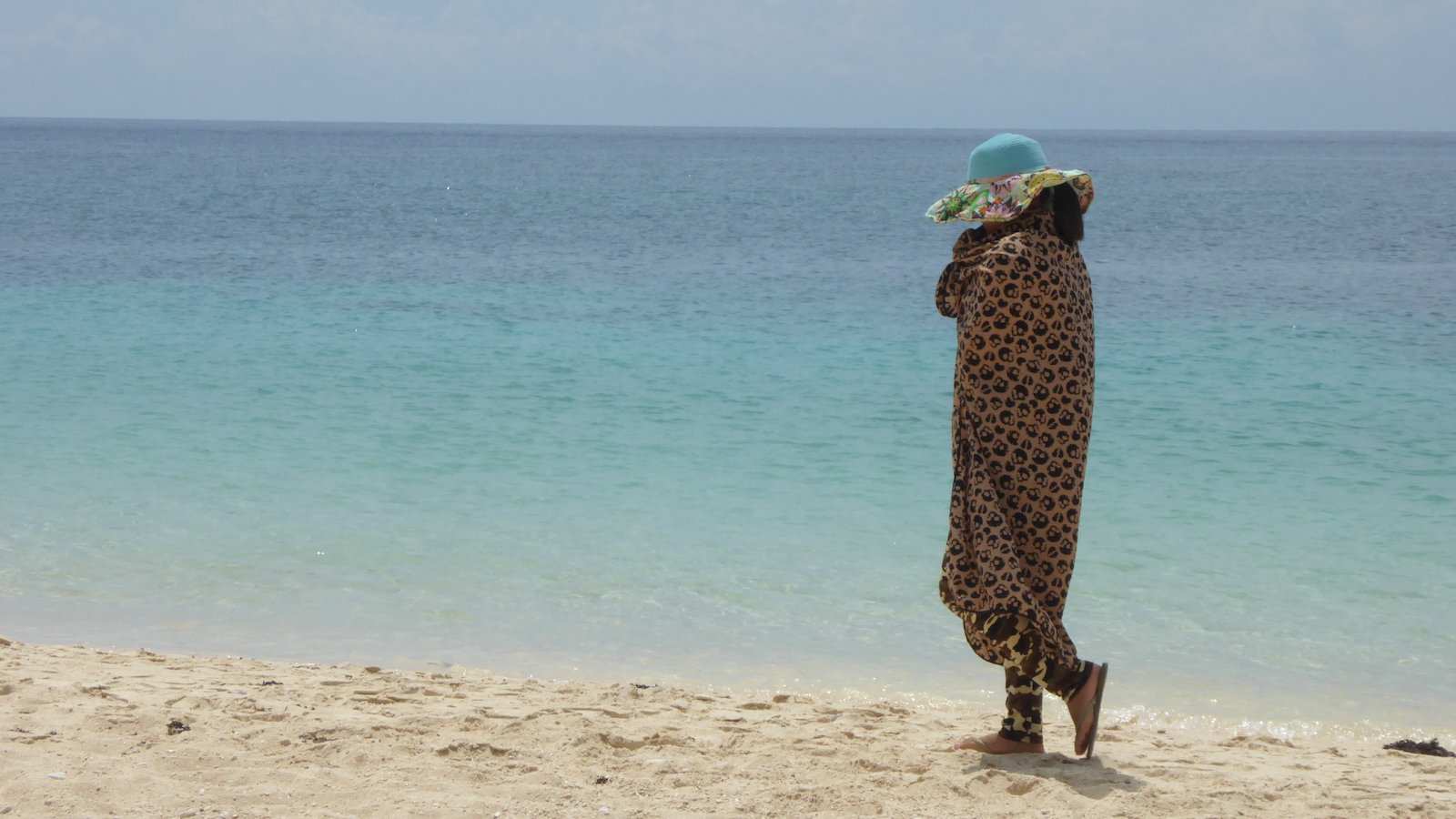 In Vietnam white skin is prized, so it's common to see women all covered up on the beach to avoid getting a tan!