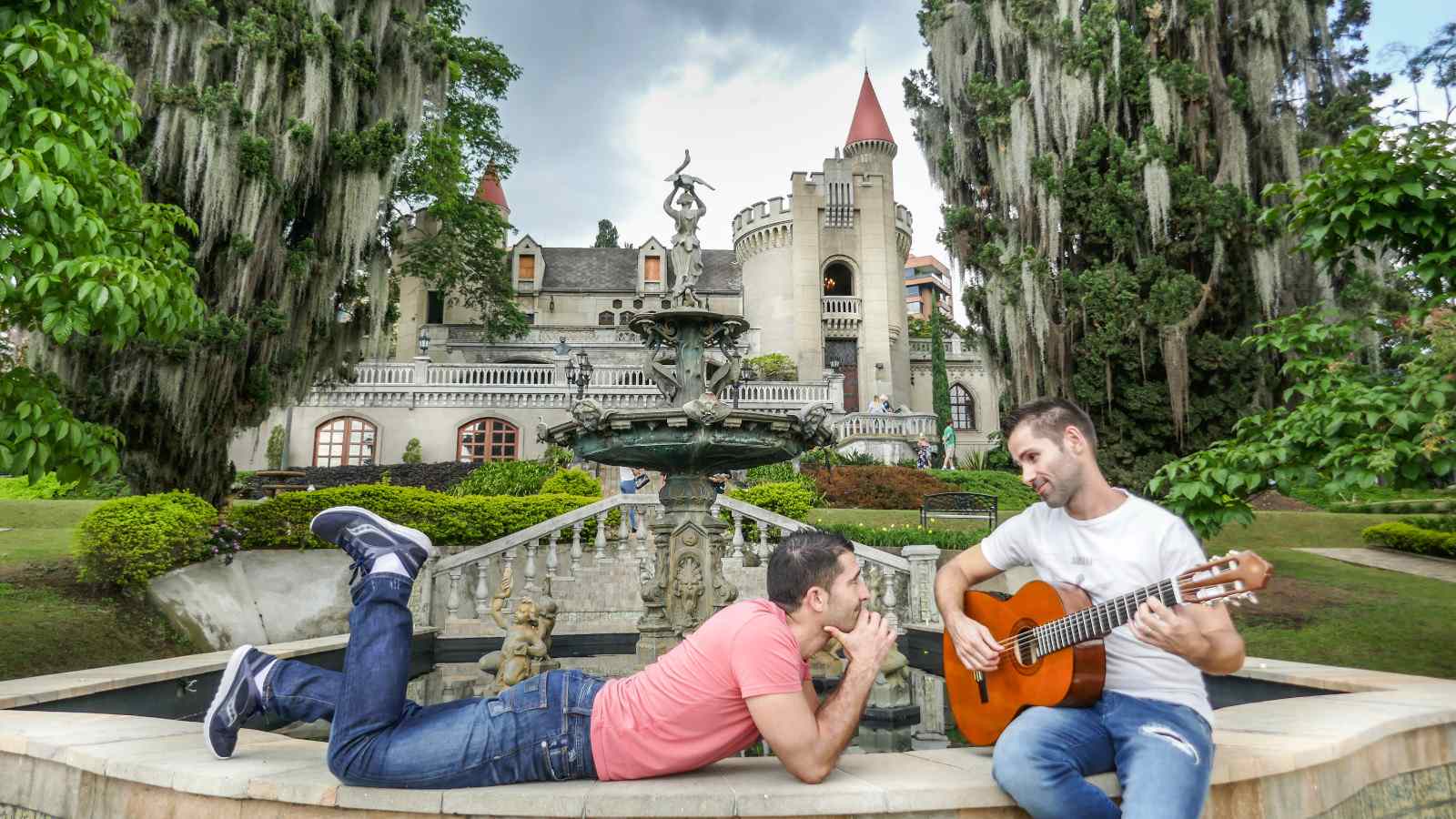 Gay couple in Medellin Seby playing guitar to Stefan.