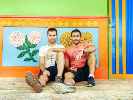 Guatape is one of the most picturesque villages in Colombia. Nomadic Boys is posing here against a house