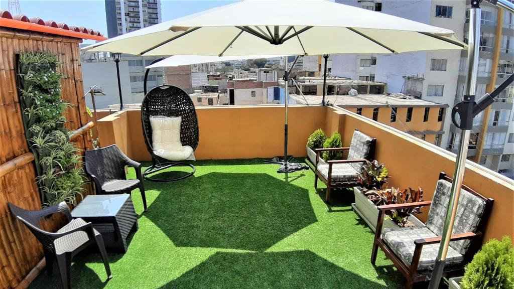 The lovely rooftop terrace at Pretty House Hotel in Lima on a sunny day.