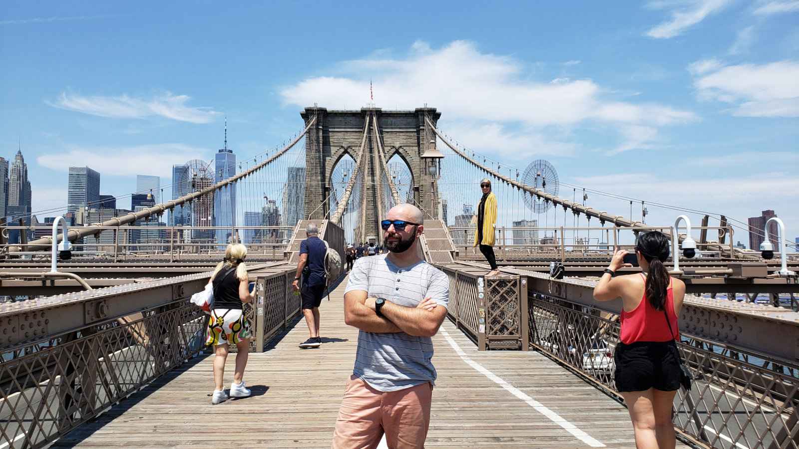 Rafael Viaja Bi proudly posing here in front of a bridge.