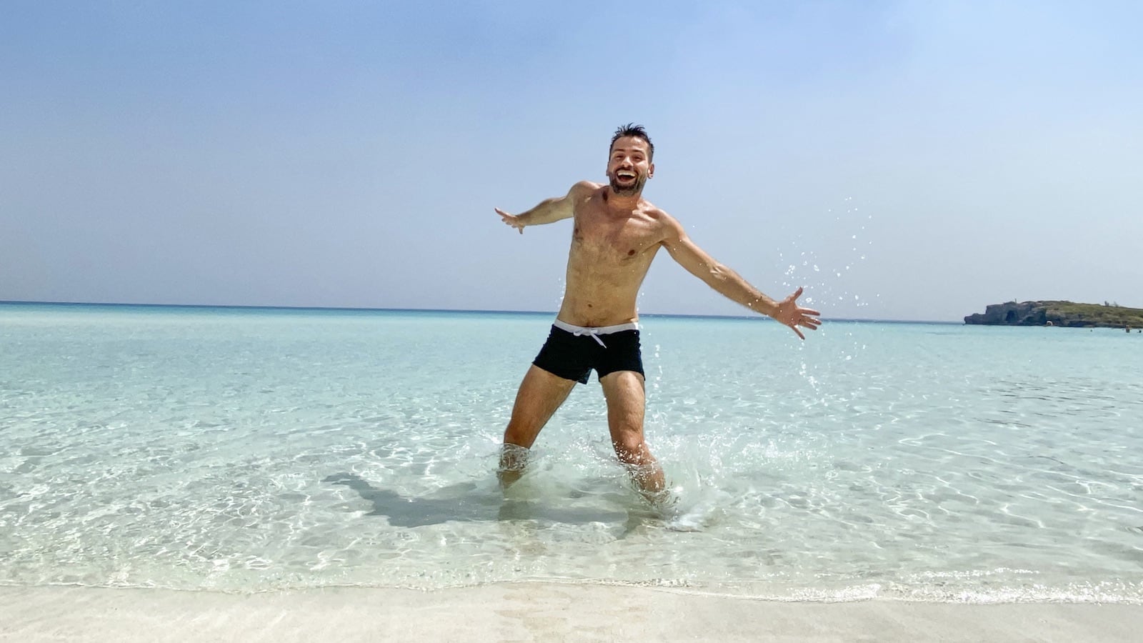 Sebastien Chaneac from Nomadic Boys bursting with happiness at the beach in Cyprus. 