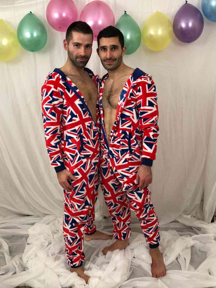 Personalized matching onesies or bathrobes are an adorable gift for a gay couple