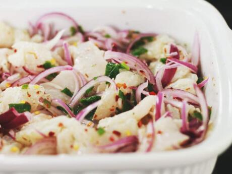Ceviche is a raw fish dish that's 'cooked' in acidic juice that you can try in the Riviera Maya area of Mexico