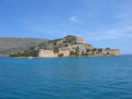 Spinalonga is a small island off the larger island of Crete that's fascinating to visit on a day trip