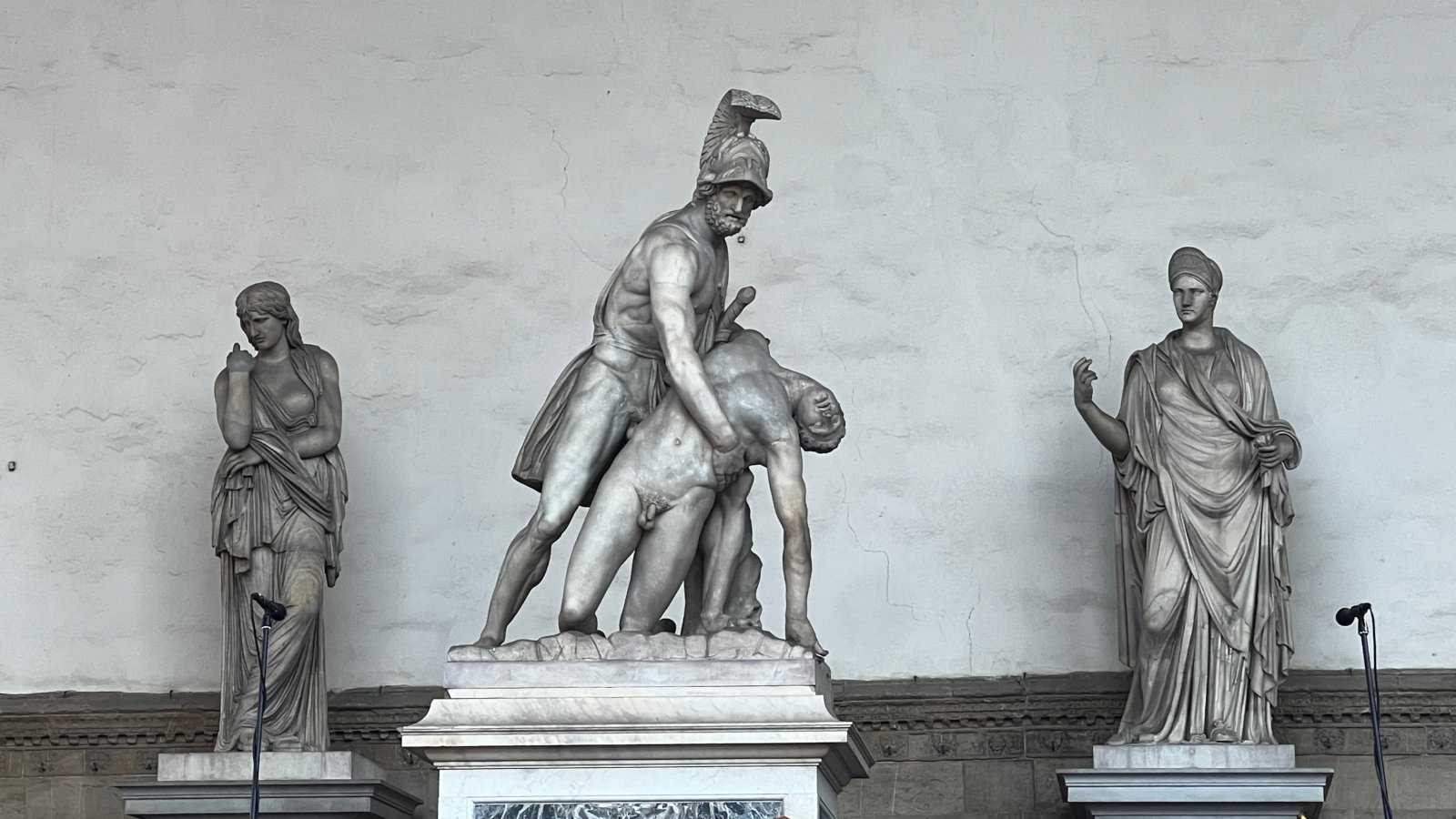 Three different statues in very dramatic poses in Florence.