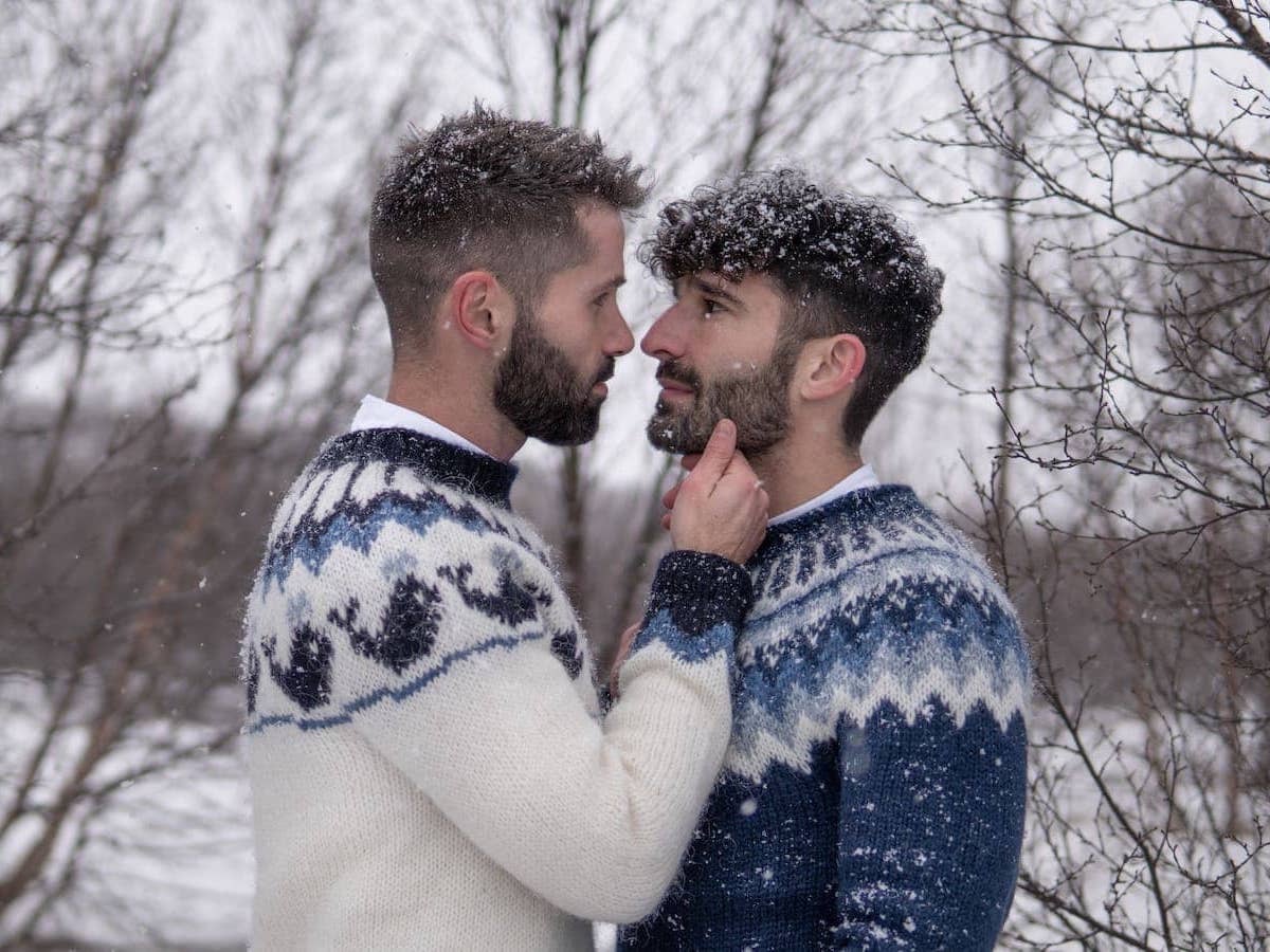Stefan and Seby embracing wearing their Icelandic sweaters.