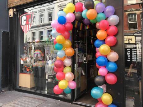 Balloons surrounding the entrance of CloneZone, a fun gay shop in London.