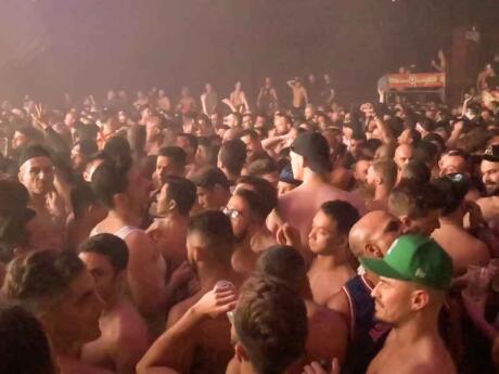 Topless men on the dancefloor at an epic Beyond gay party at Fire club in London.