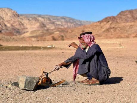 Bedouin man making fresh bread in the desert of Jordan.