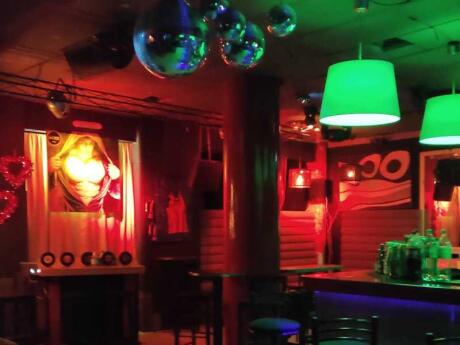 The moody decor lit up in red at Bizzar gay club in Athens.