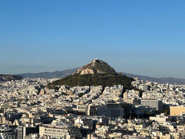 Lycabettus Hill in Athens on a clear day as seen from the Acropolis.