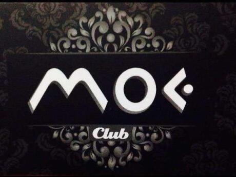 The words Moe Club in stylized text on a black background with filigree.