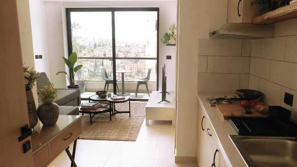 A light and airy open living flat from Nu Fifty two overlooking the city of Amman.